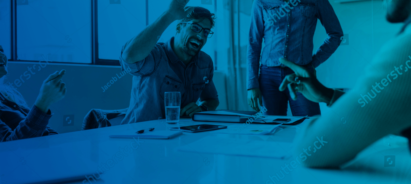 Man and woman laughing in the workplace - Matera